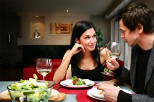 happy-couple-at-home-having-dinner